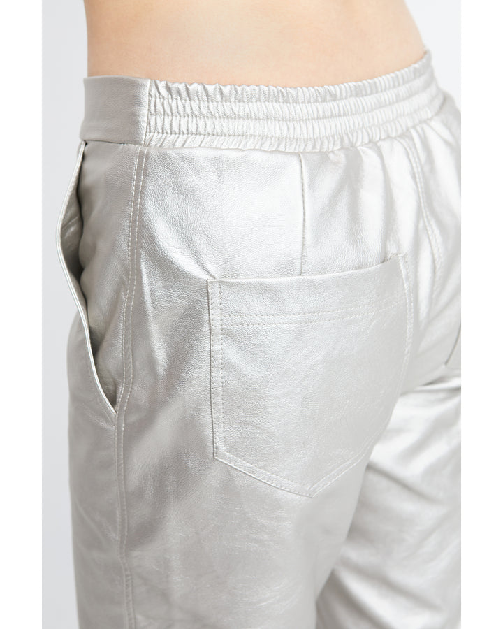 The back view of a fashion forward woman wearing Ozai N Ku Metallic Pants in Gloss.
