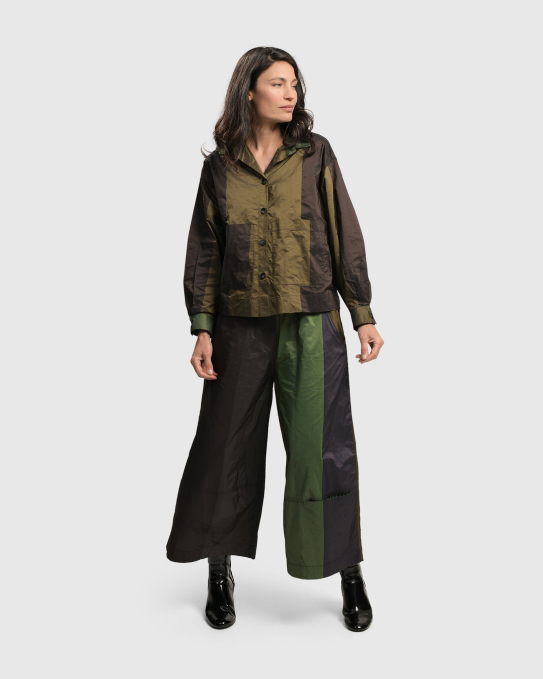 A woman wearing Alfresco Market Pants in a Forest colored palette and an elastic waistband by ALEMBIKA.